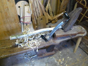 handle in shave horse with drawknife