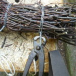 Trimming the twisted wire with pincers